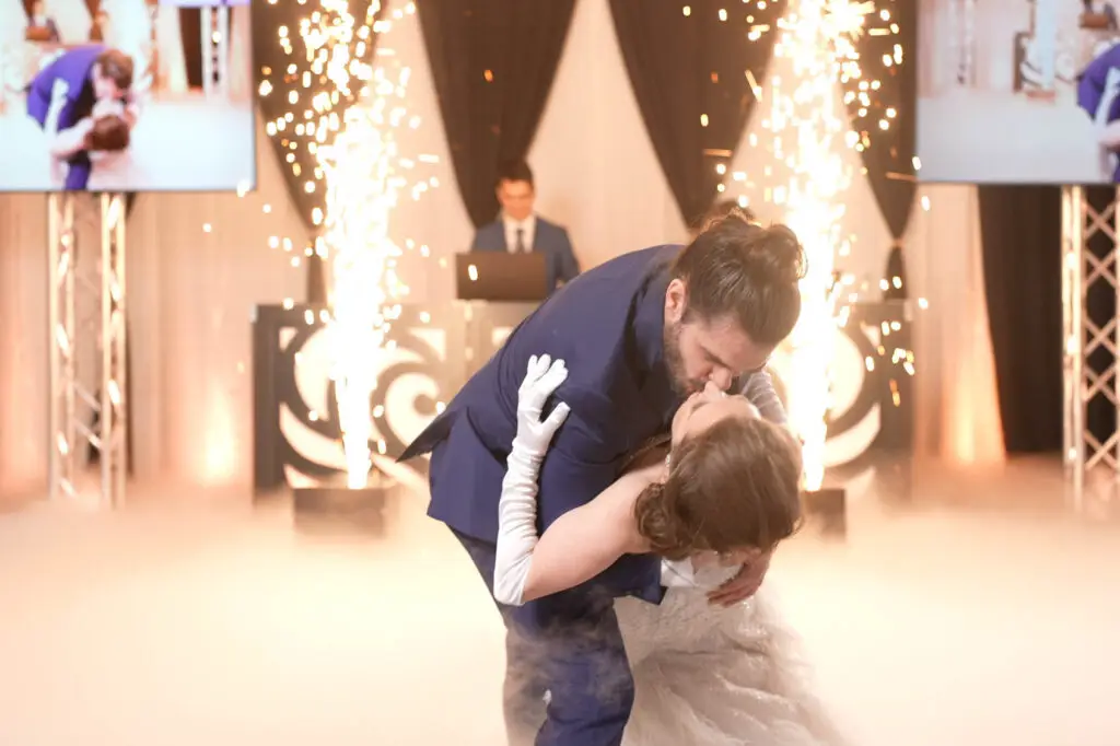 Bride and groom dancing with sparks, cold sparks