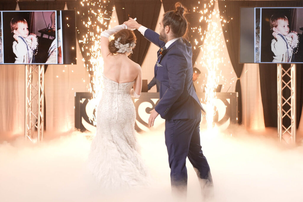 Bride and groom dancing with sparks, cold sparks