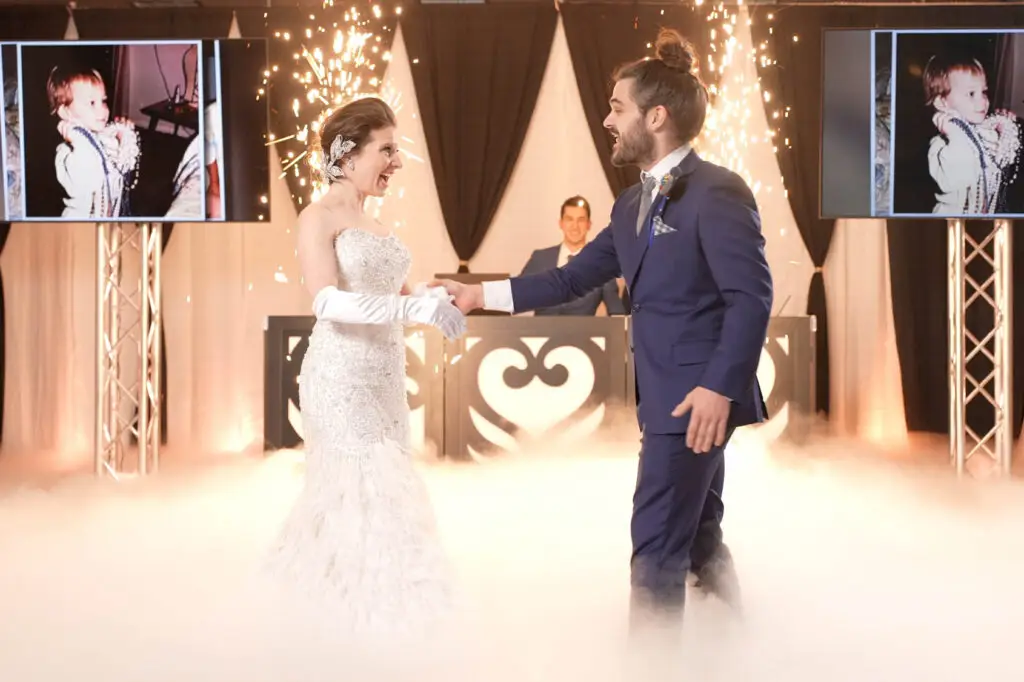 Bride and groom dancing with sparks, cold sparks