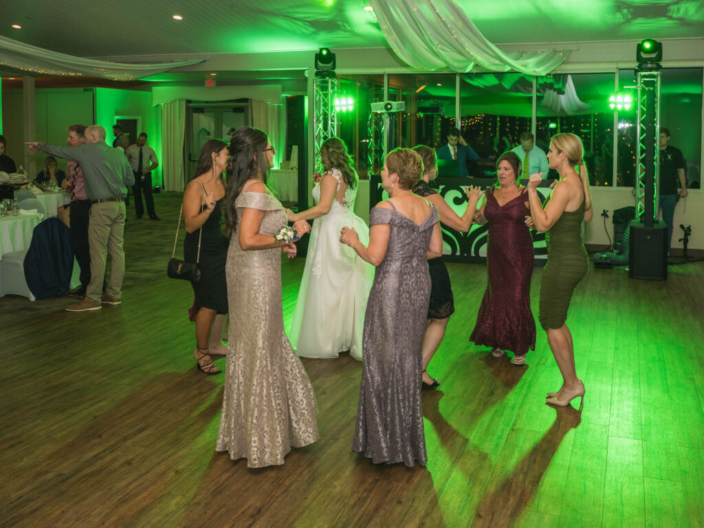 Green uplighting on wedding dancefloor at woodstone country club & lodge