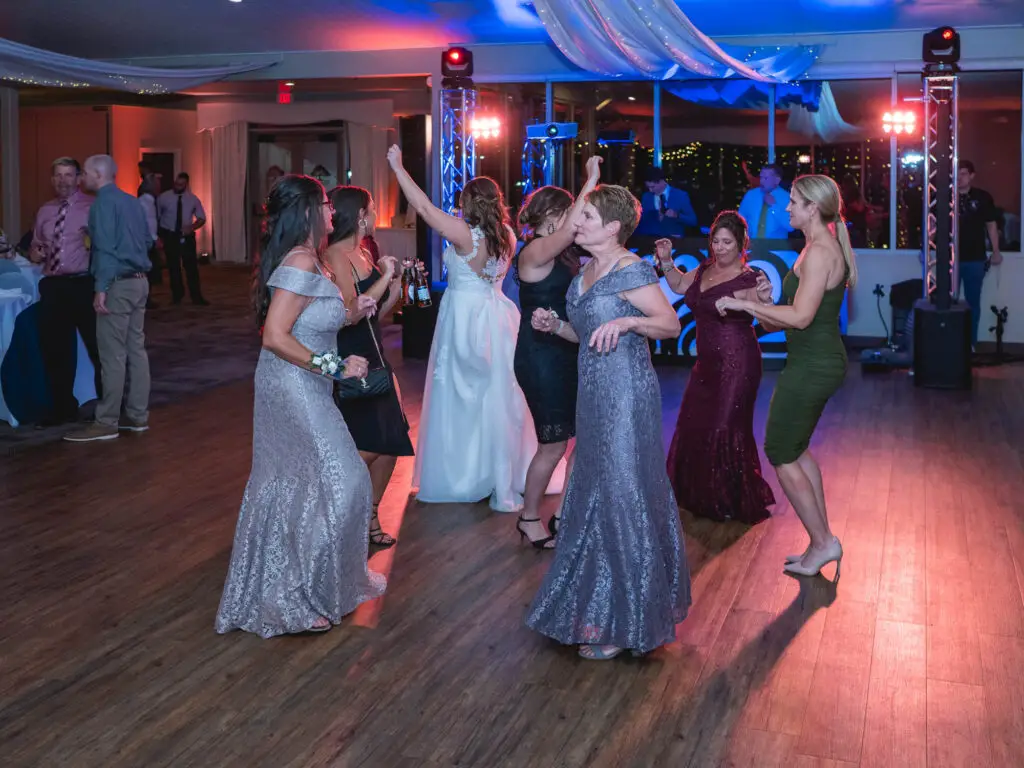 Multi-color uplighting on wedding dancefloor at woodstone country club & lodge