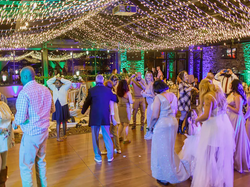 Multi-color uplighting on dancefloor at blue mountain resort