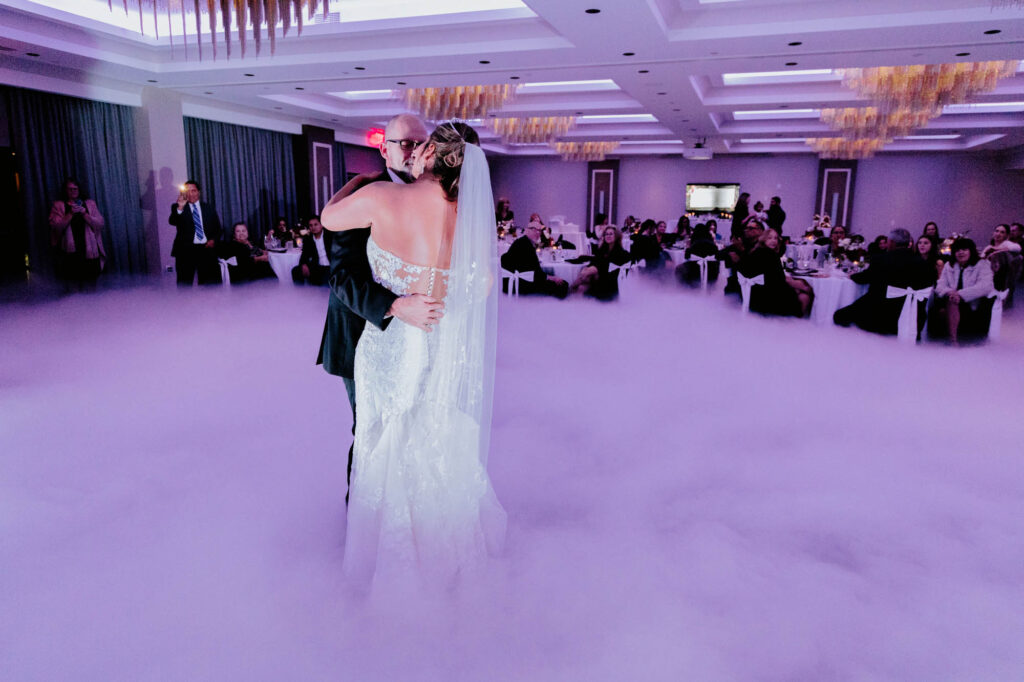 Bride and groom first dance dancing on the clouds
